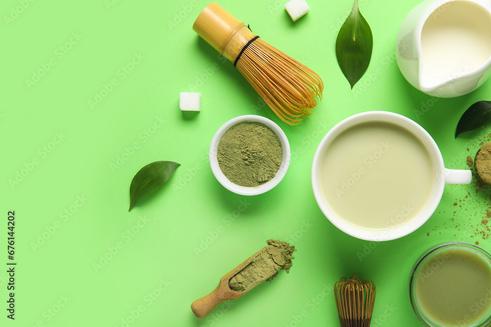 Composition with cup of fresh matcha tea, powder, milk and accessories on color background