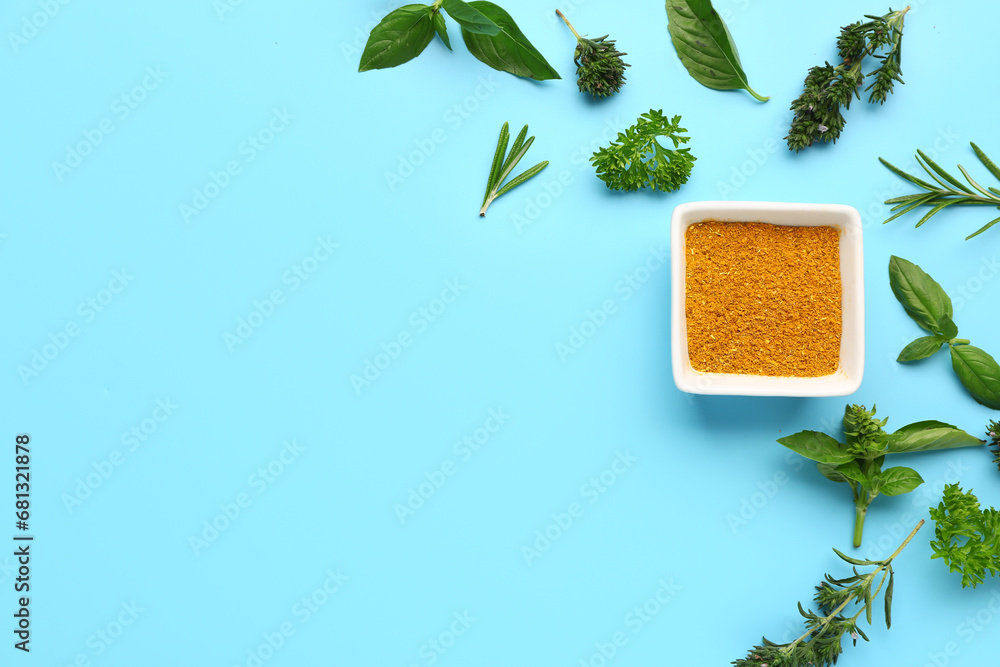 Composition with bowl of spices and fresh herbs on color background