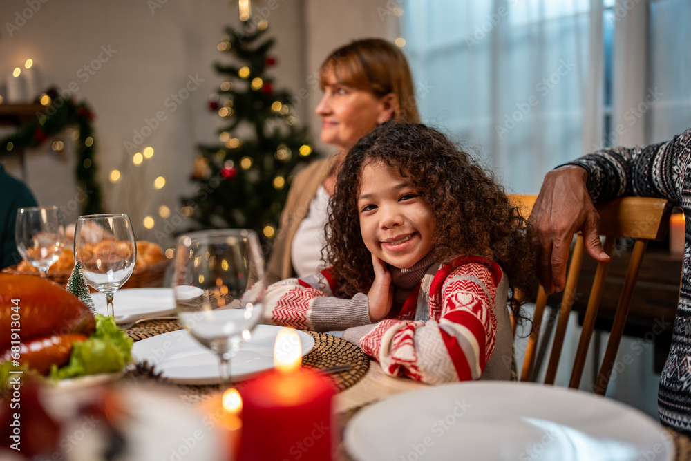 Portrait of African American kid celebrate Christmas party with family. 